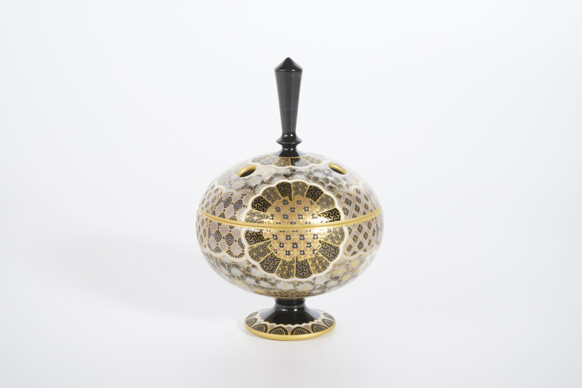 Incense burner with gold and silver design of flowers and grasses